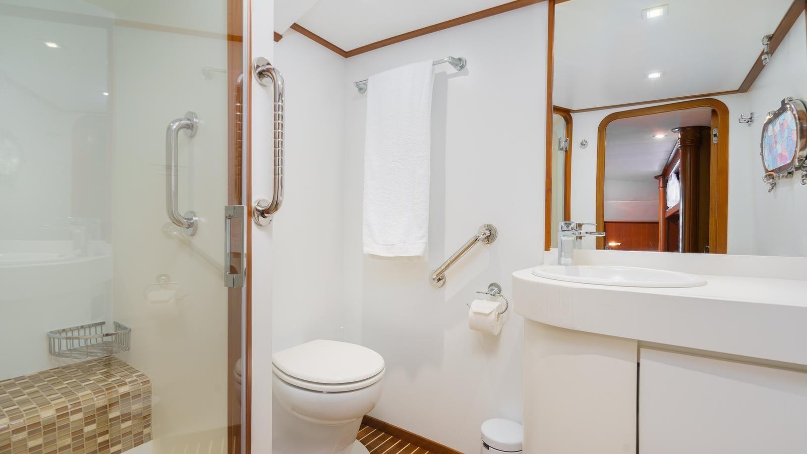 a bathroom with a toilet and sink aboard SPIRIT OF MK Yacht for Sale
