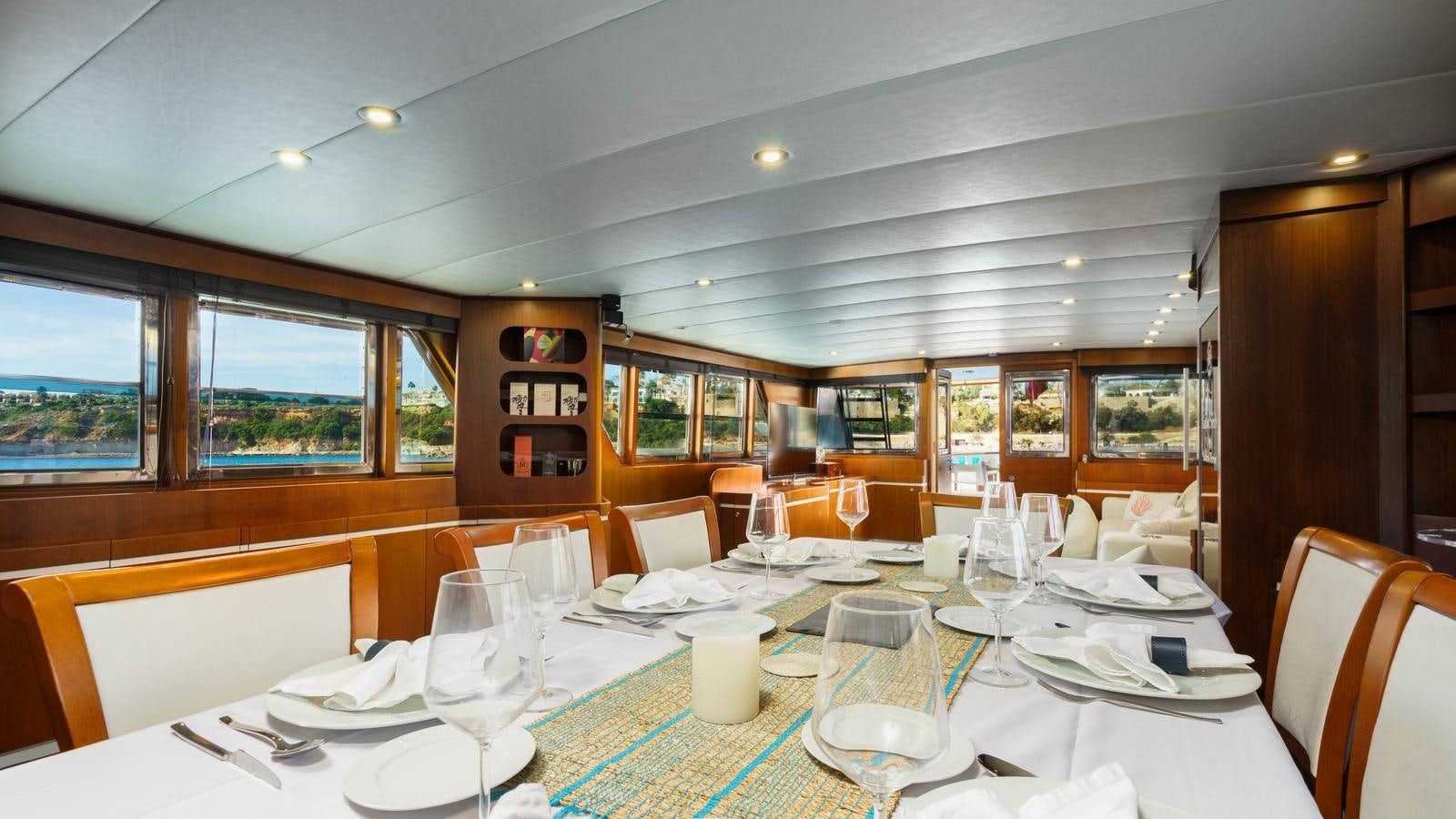 a table set for a dinner aboard SPIRIT OF MK Yacht for Sale