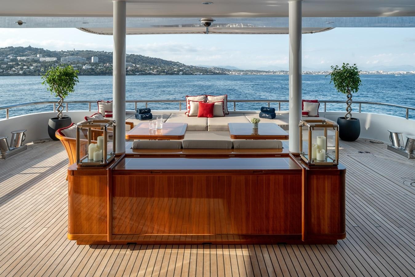 a table with chairs and a plant on it aboard ALFA G Yacht for Sale