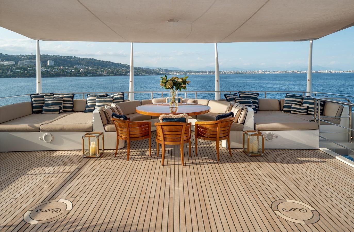a room with a table and chairs aboard ALFA G Yacht for Sale