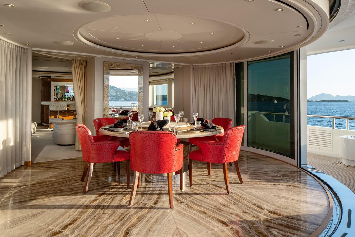 a dining room with a large window aboard ALFA G Yacht for Sale