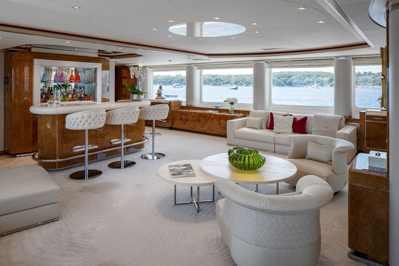a living room with a large window aboard ALFA G Yacht for Sale