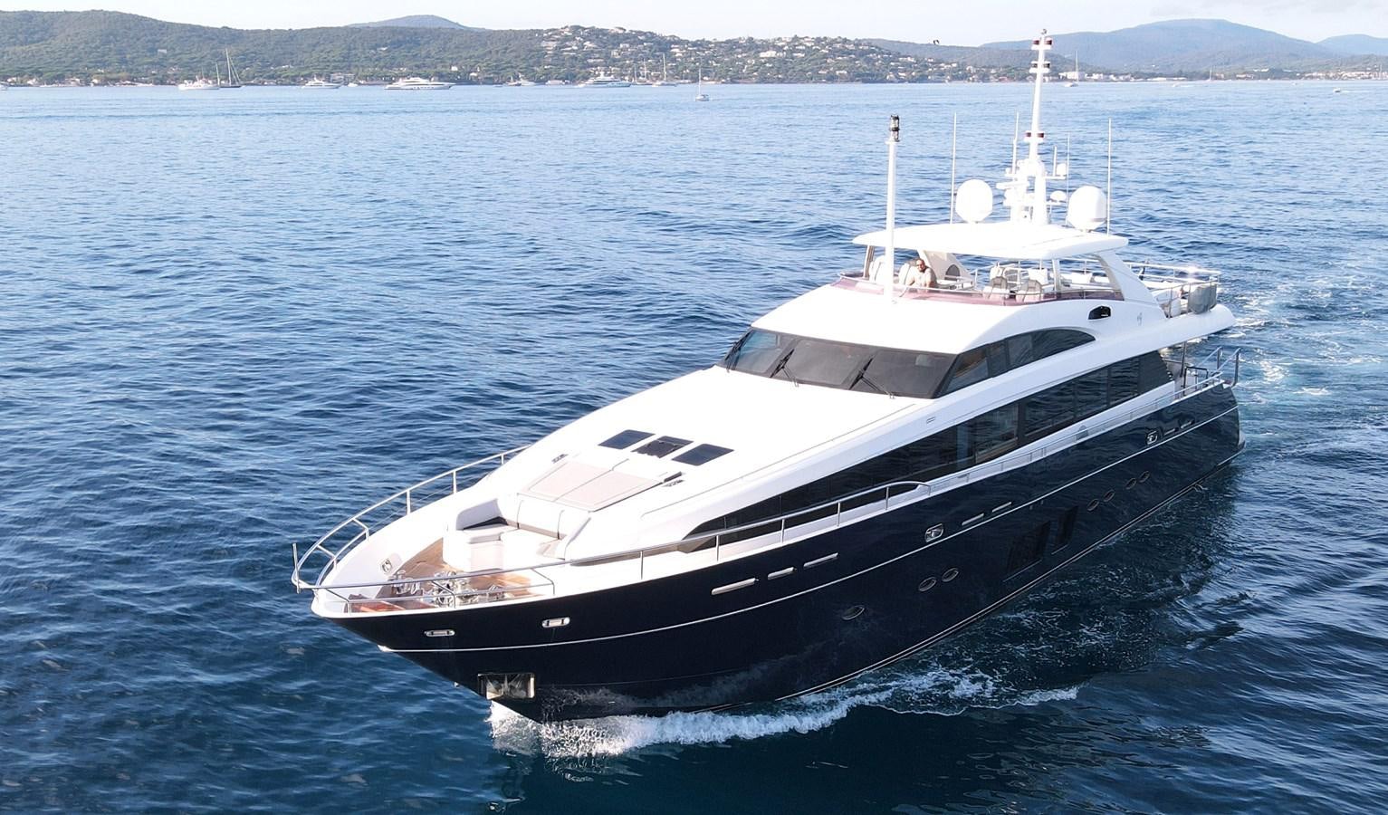 a large white boat in the water aboard FLY Yacht for Sale