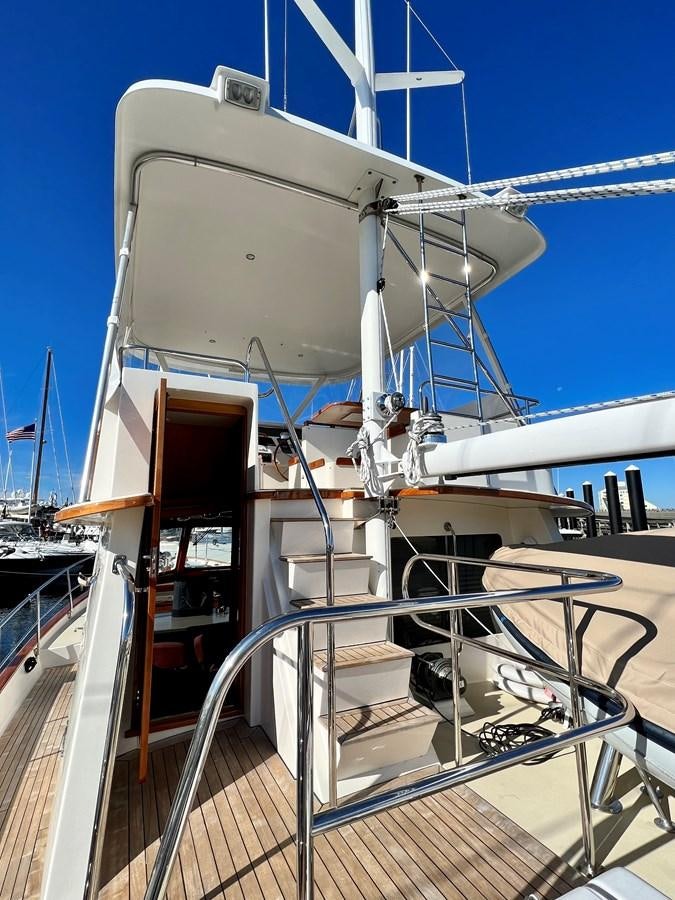 a large white boat with a large white sail aboard COTYTTO Yacht for Sale
