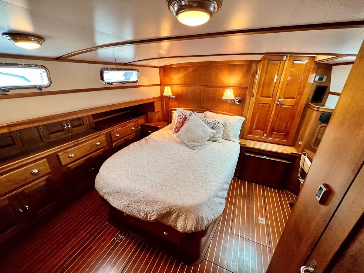 a bed in a cabin aboard COTYTTO Yacht for Sale
