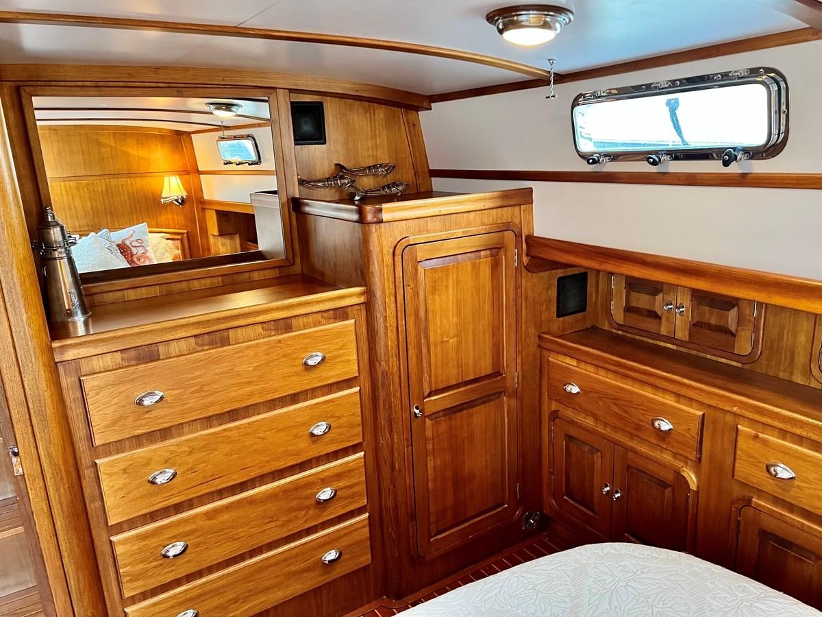 a wooden cabinet with drawers aboard COTYTTO Yacht for Sale