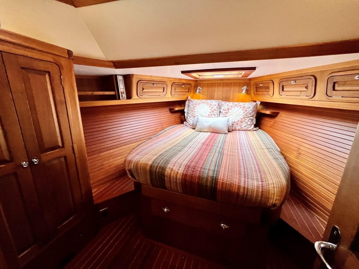 a bed in a cabin aboard COTYTTO Yacht for Sale