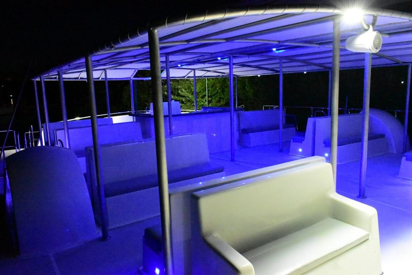 a room with a pool table and chairs aboard SEA COMPASS 82 Yacht for Sale