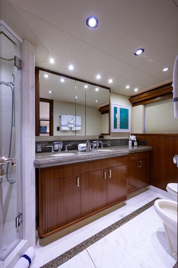 a bathroom with a large mirror aboard LADY JJ Yacht for Charter