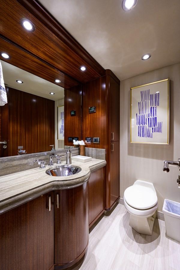 a bathroom with a sink toilet and a mirror aboard LADY JJ Yacht for Charter