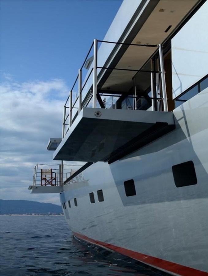 a large white boat in the water aboard NAIA Yacht for Sale
