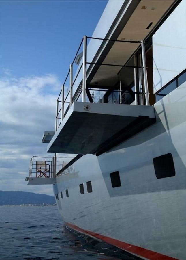 a large white boat on the water aboard NAIA Yacht for Sale
