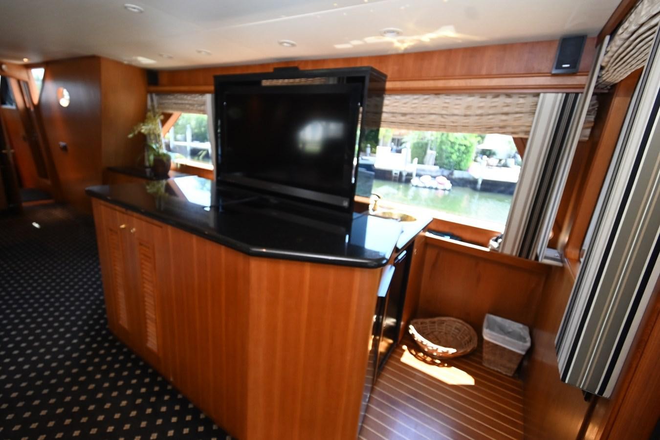 a kitchen with a tv aboard CAPTIVATOR Yacht for Sale