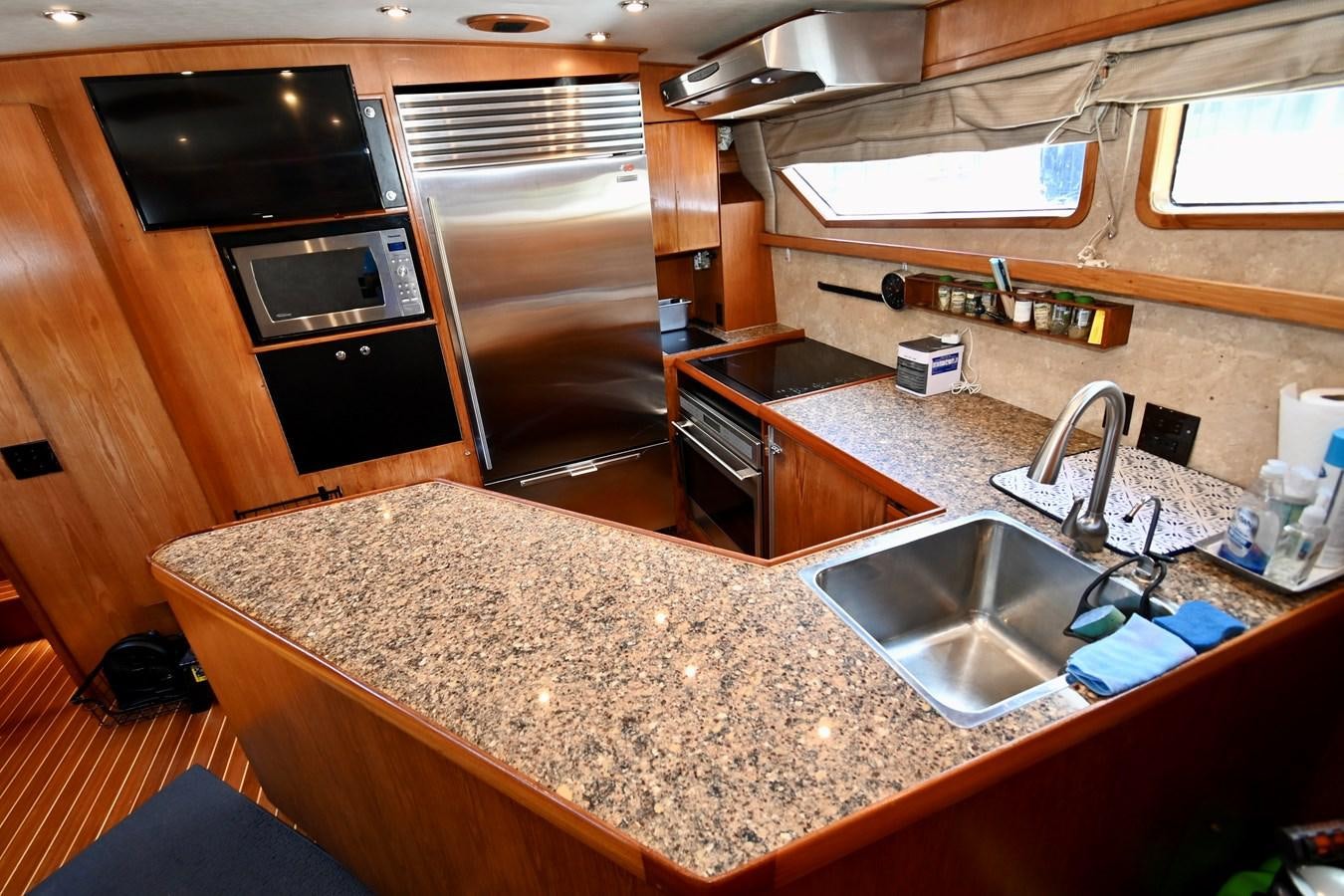 a kitchen with a large countertop aboard CAPTIVATOR Yacht for Sale