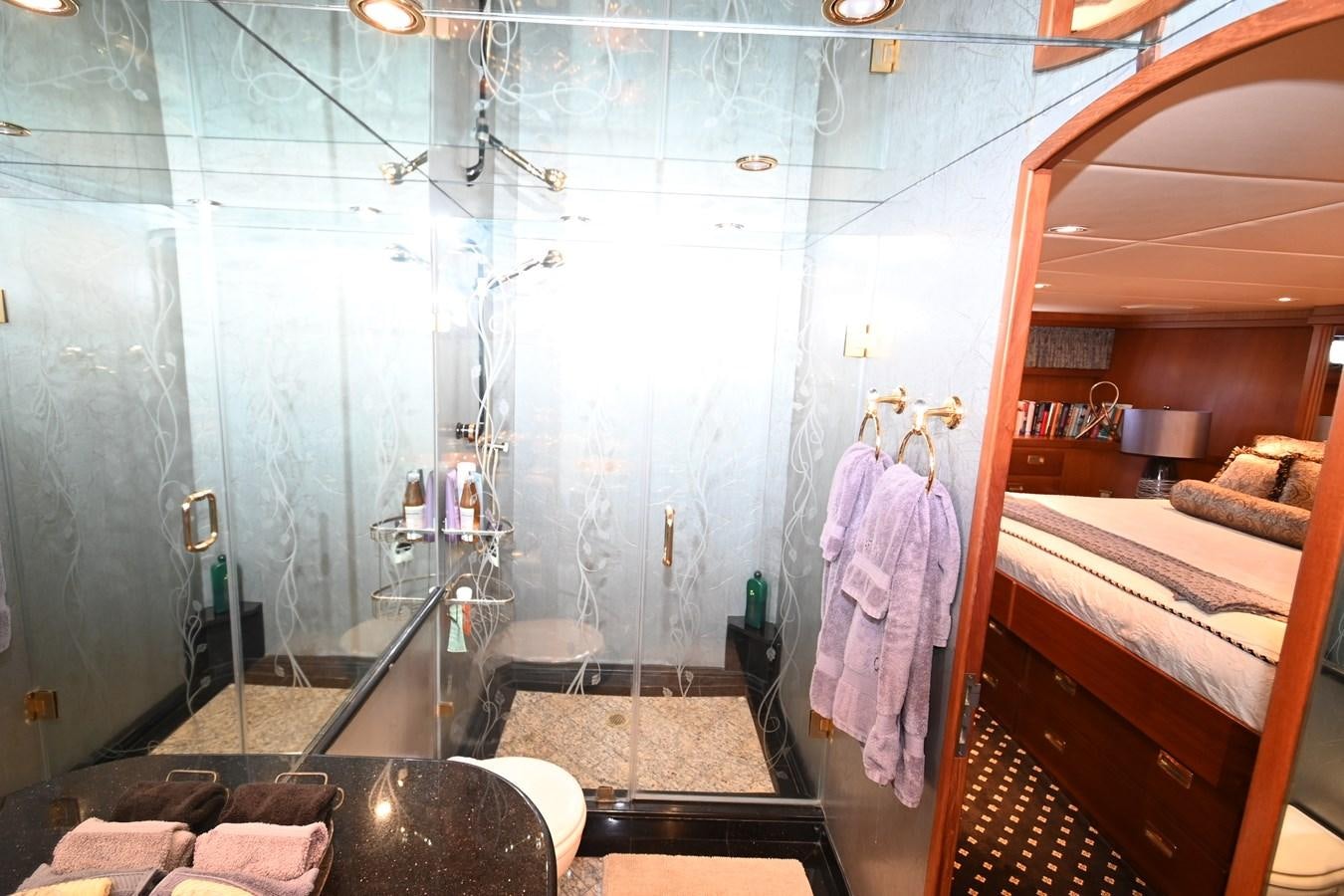 a bathroom with a shower aboard CAPTIVATOR Yacht for Sale