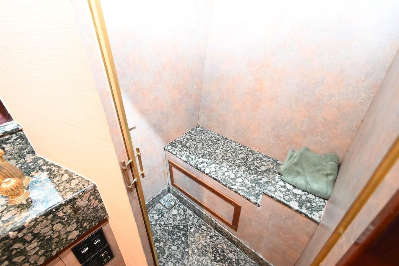 a bed in a room aboard CAPTIVATOR Yacht for Sale