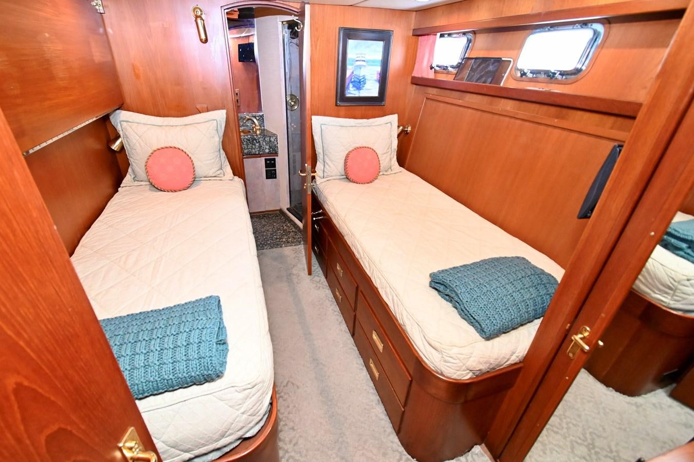 a room with two beds aboard CAPTIVATOR Yacht for Sale
