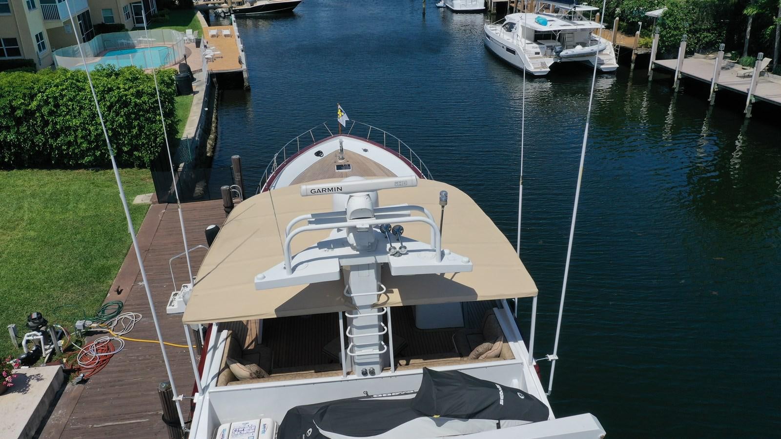 a boat tied to a dock aboard CAPTIVATOR Yacht for Sale