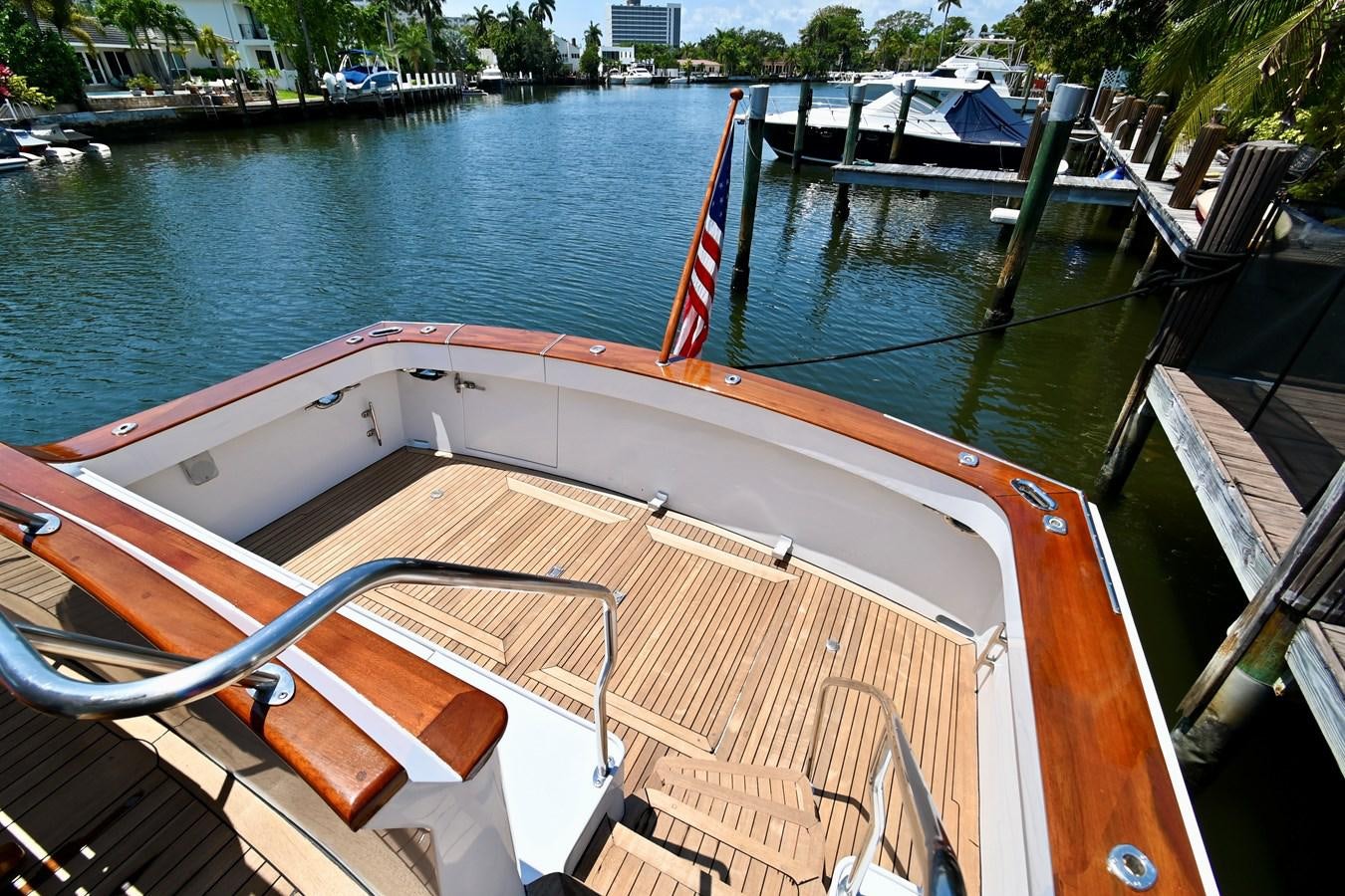 a boat with a red stripe aboard CAPTIVATOR Yacht for Sale