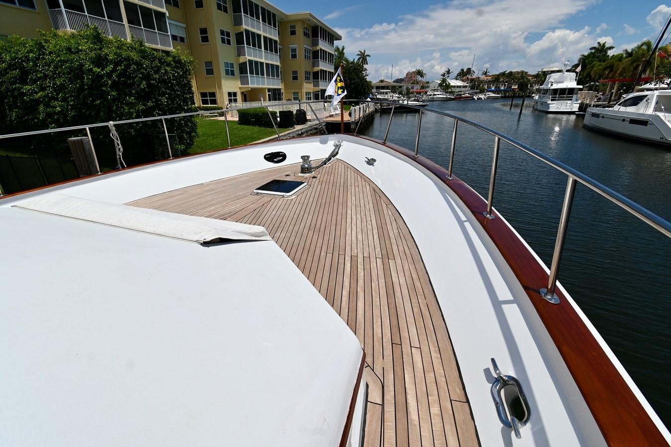 a deck with a boat on it aboard CAPTIVATOR Yacht for Sale