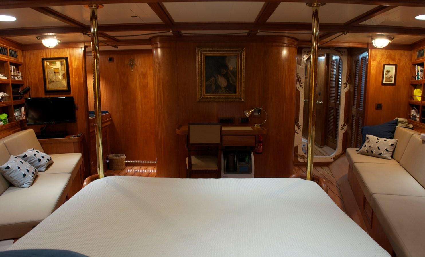 a bedroom with a bed and a desk aboard NO.6 TEXEL Yacht for Sale