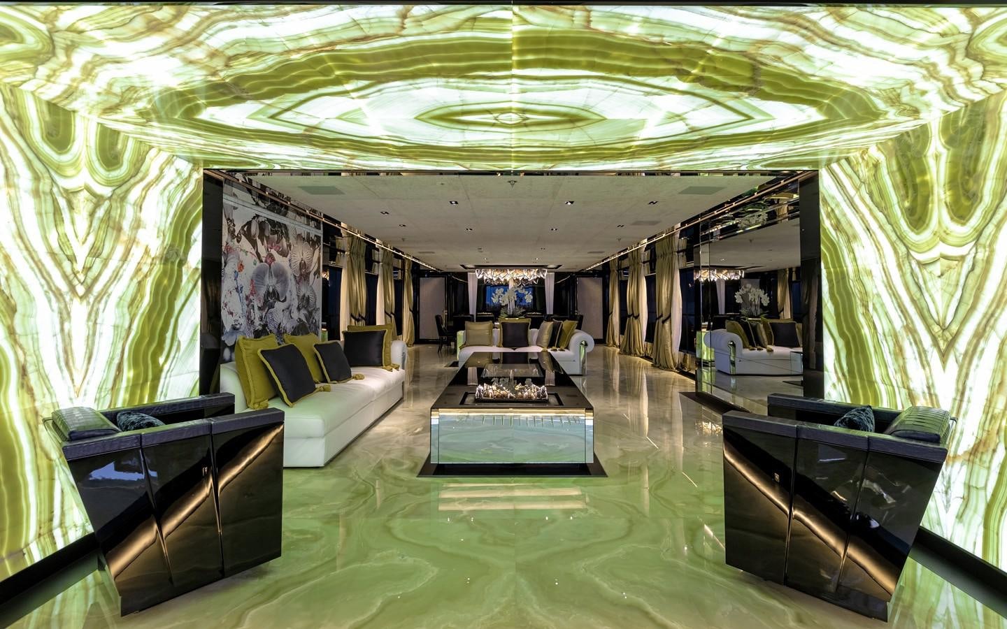 a room with a couch and a table aboard SARASTAR Yacht for Sale