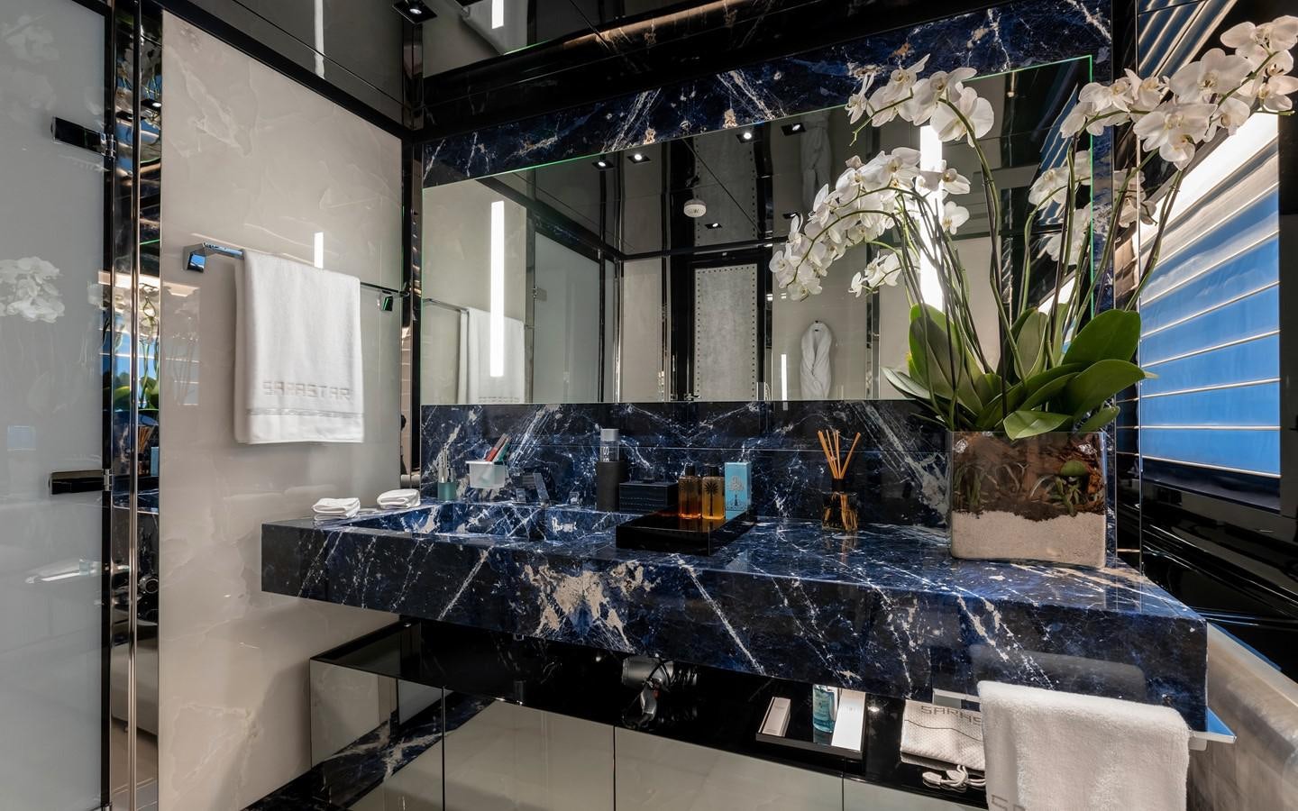 a bathroom with a large marble counter aboard SARASTAR Yacht for Sale