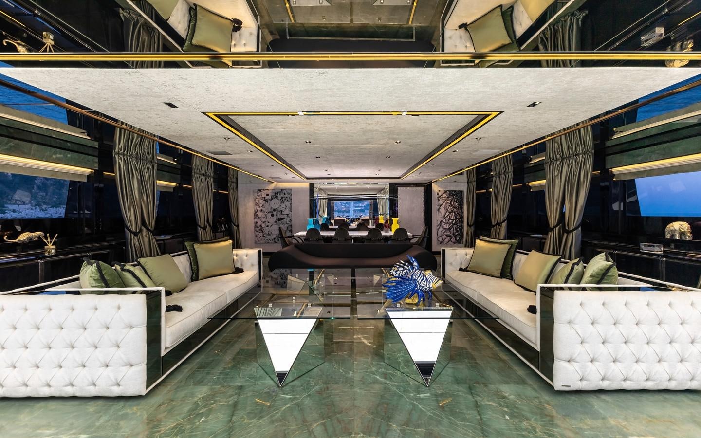 a room with couches and a table aboard SARASTAR Yacht for Sale