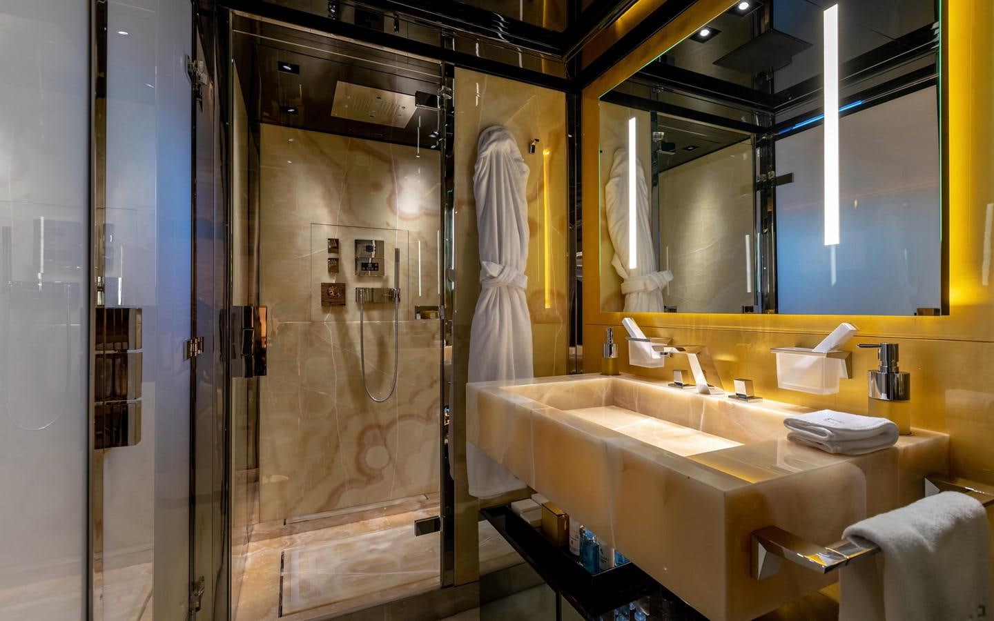 a bathroom with a large mirror aboard SARASTAR Yacht for Sale