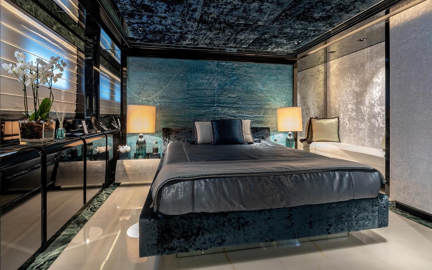 a room with a bed and a table aboard SARASTAR Yacht for Sale