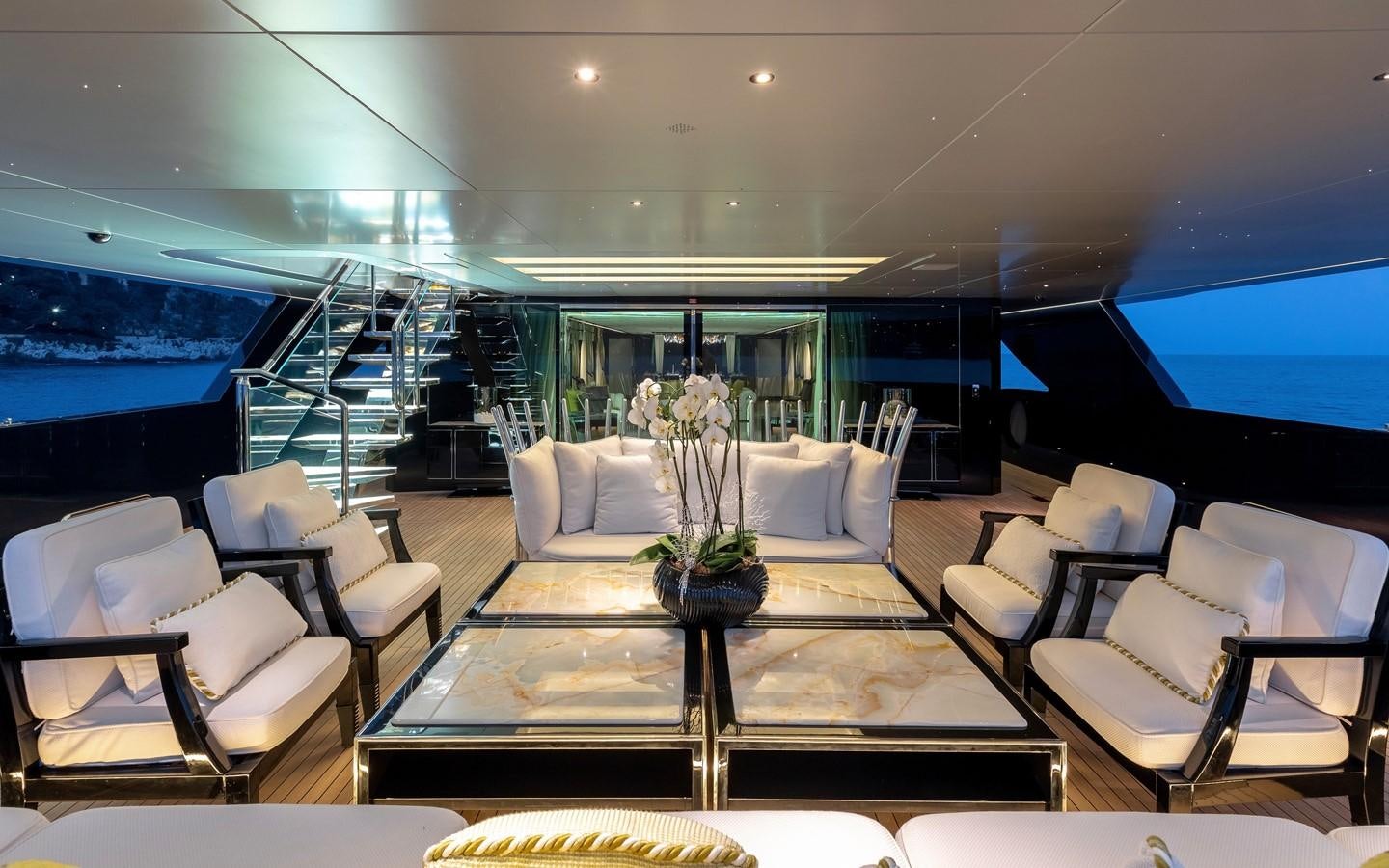 a living room with a large screen aboard SARASTAR Yacht for Sale