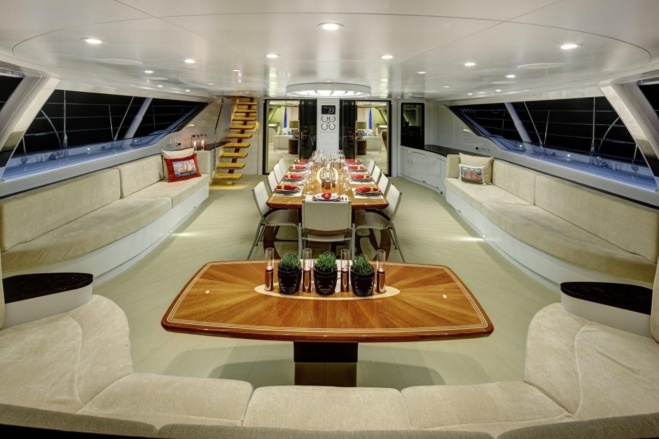 a large room with a table and chairs aboard SALVAJE Yacht for Charter