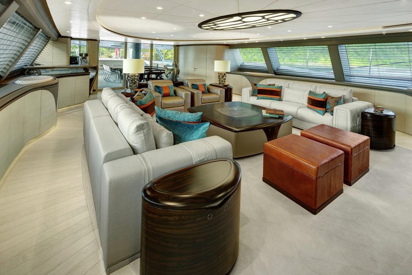 a living room with a large window aboard SALVAJE Yacht for Charter
