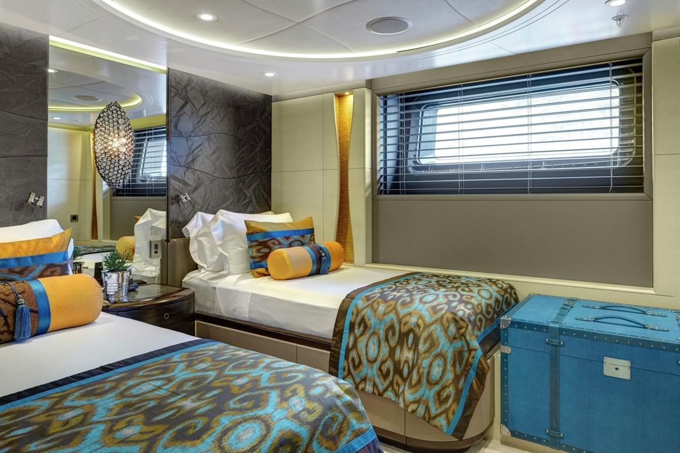 a couple of beds in a hotel room aboard SALVAJE Yacht for Charter