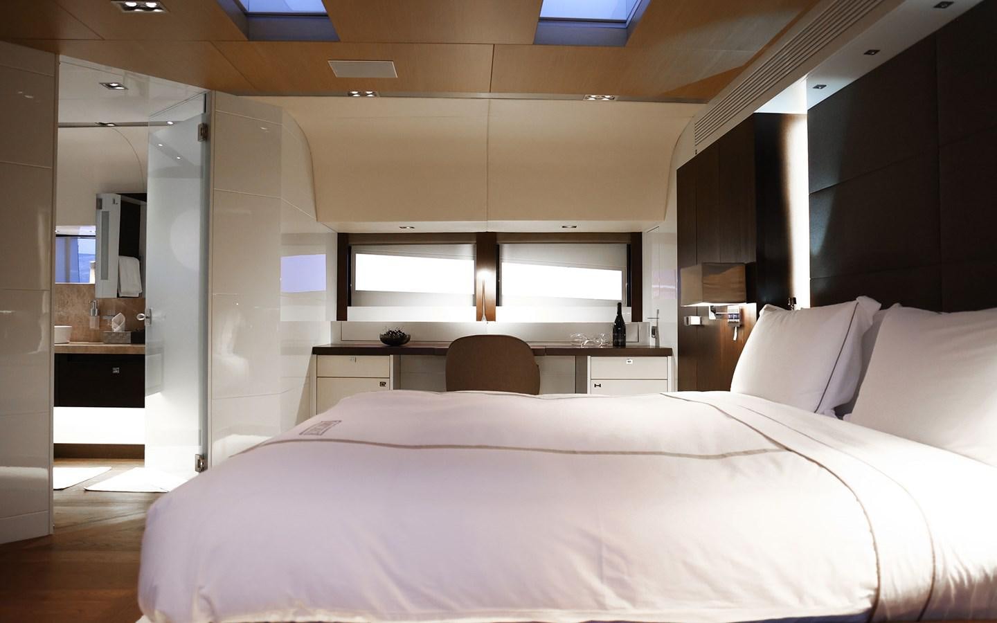 a bed with a white sheet aboard FUNKY CHOICE Yacht for Sale