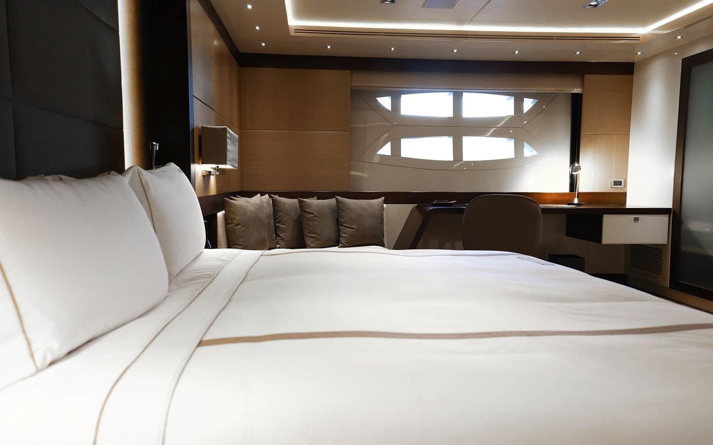 a bed with white sheets aboard FUNKY CHOICE Yacht for Sale