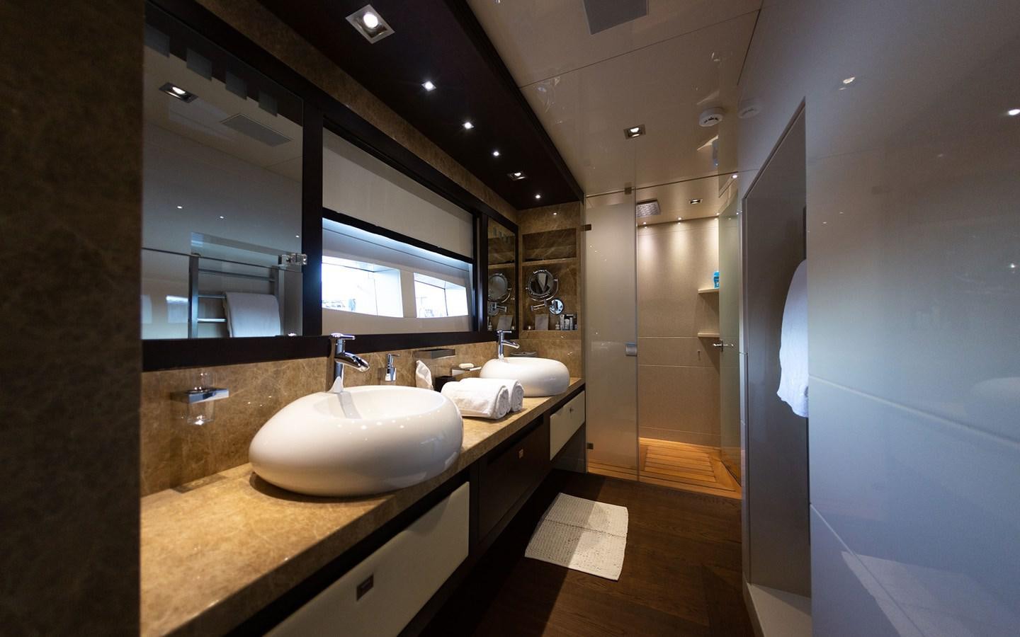 a bathroom with a large mirror aboard FUNKY CHOICE Yacht for Sale