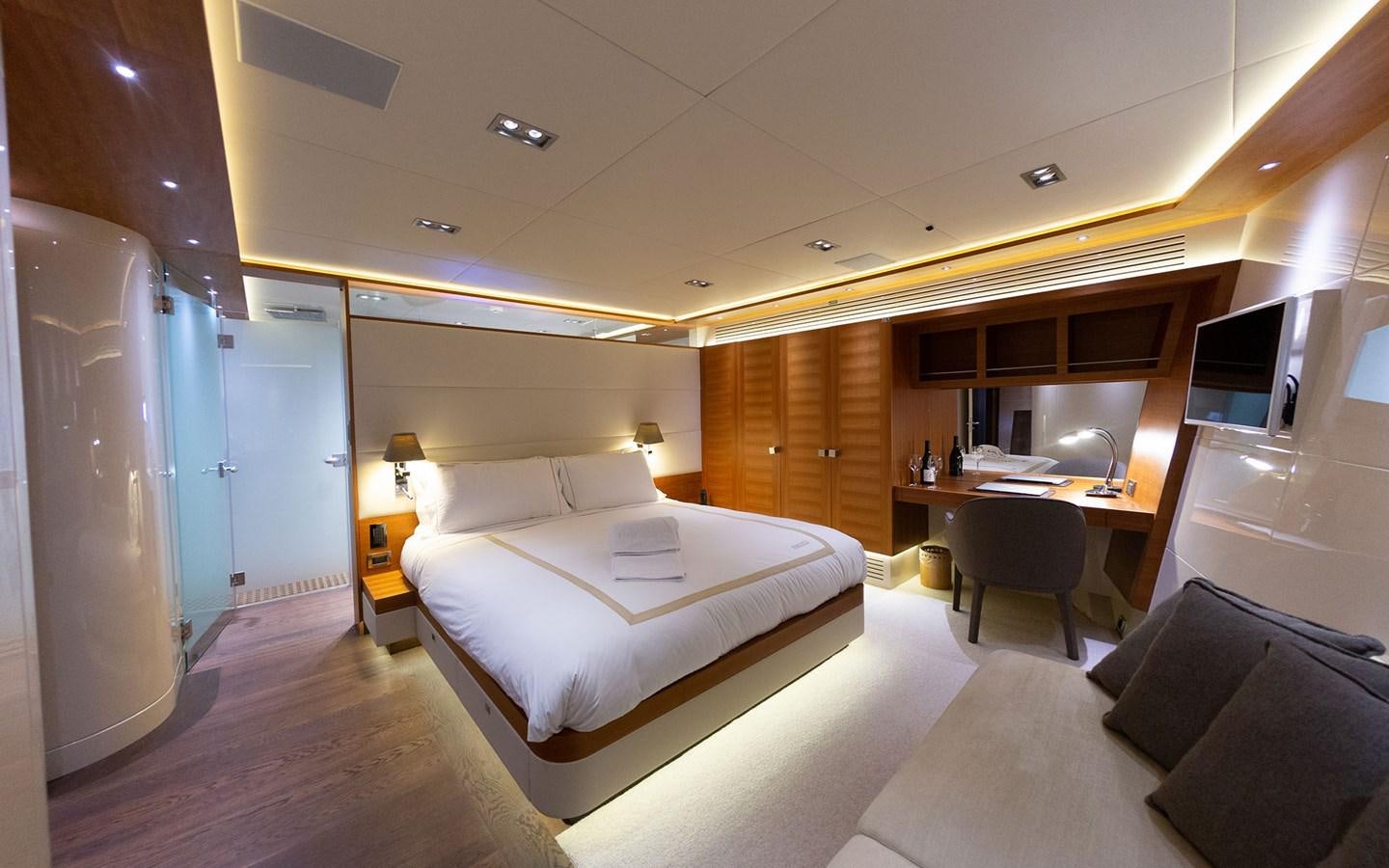 a room with a bed and a desk aboard FUNKY CHOICE Yacht for Sale