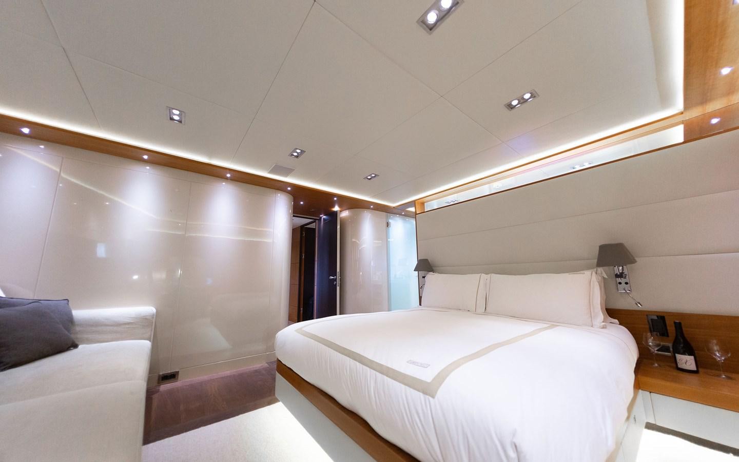 a room with a bed and a couch aboard FUNKY CHOICE Yacht for Sale