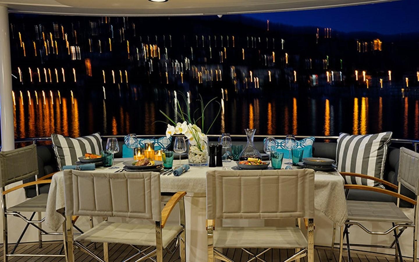 a table set for a dinner party aboard EXCELERATE Z Yacht for Sale