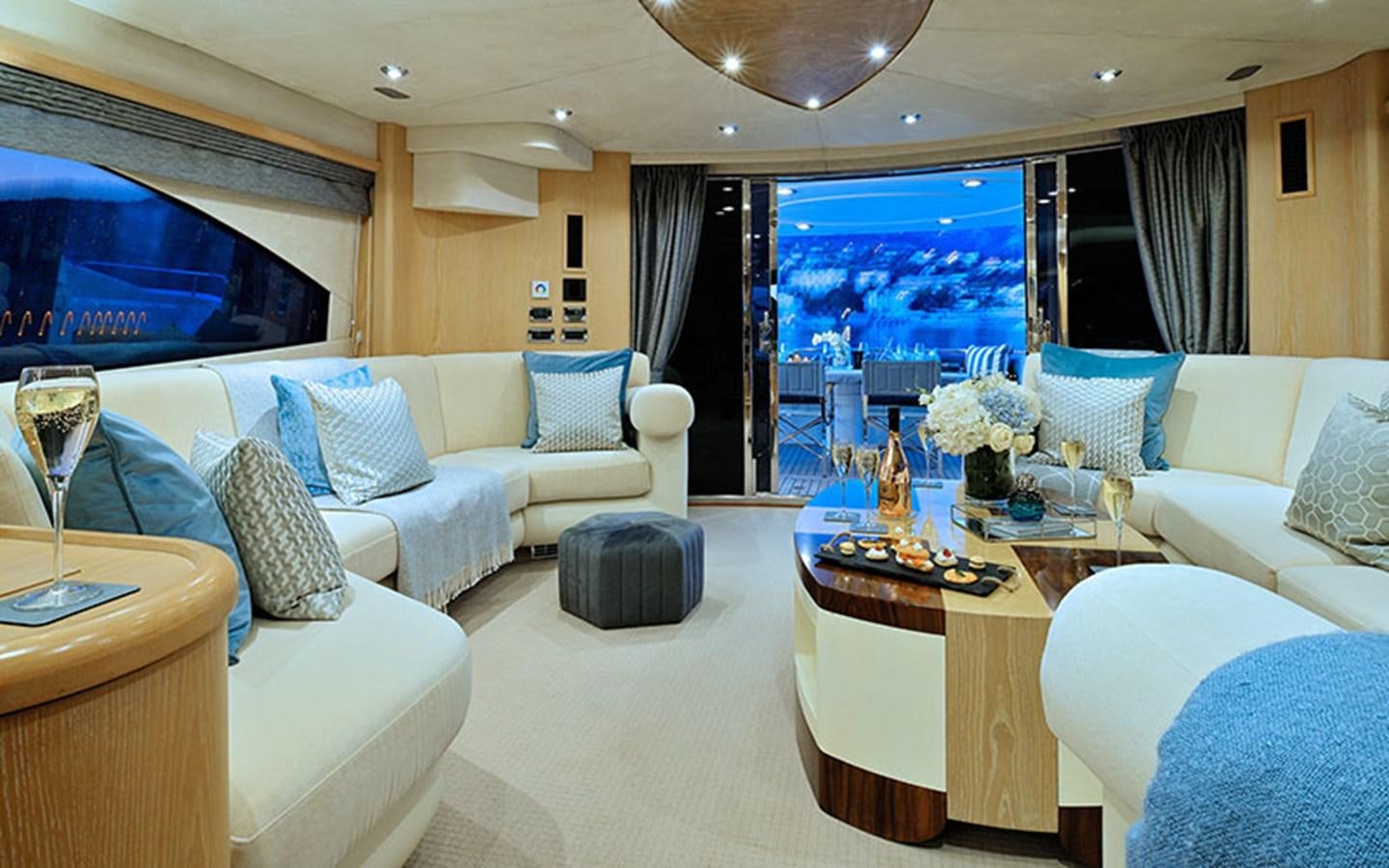 a living room with a large screen aboard EXCELERATE Z Yacht for Sale