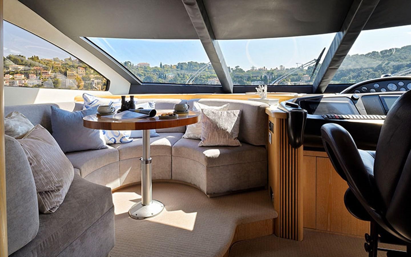 a room with couches and a table aboard EXCELERATE Z Yacht for Sale