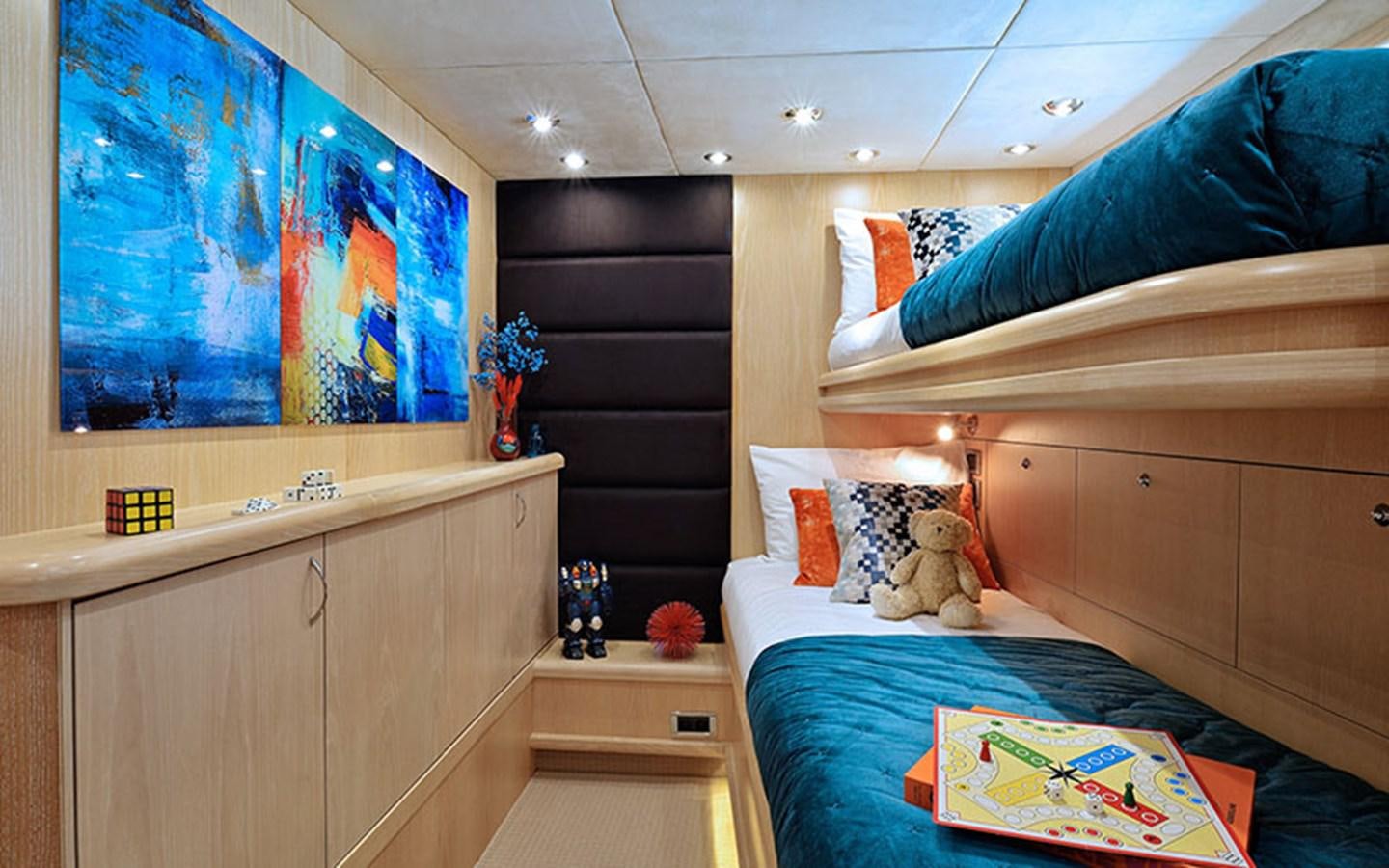 a room with a bed and a desk aboard EXCELERATE Z Yacht for Sale