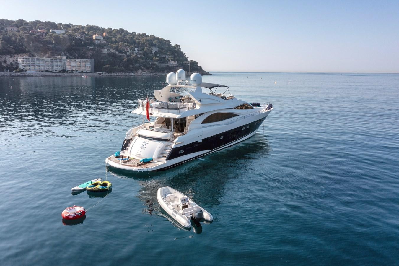 a boat and a small boat in the water aboard EXCELERATE Z Yacht for Sale