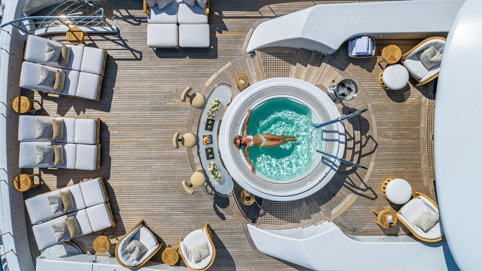 a person in a bathtub with a hose attached to it aboard MARGUERITE Yacht for Charter