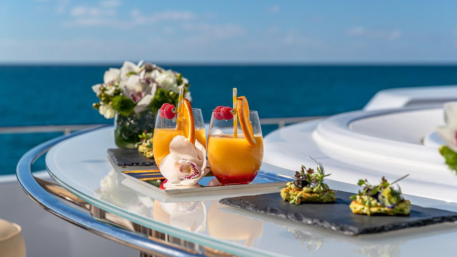 a tray with drinks and fruits on it aboard MARGUERITE Yacht for Charter