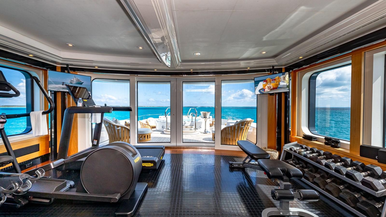 inside of a vehicle with a large window and a view of the water aboard MARGUERITE Yacht for Charter