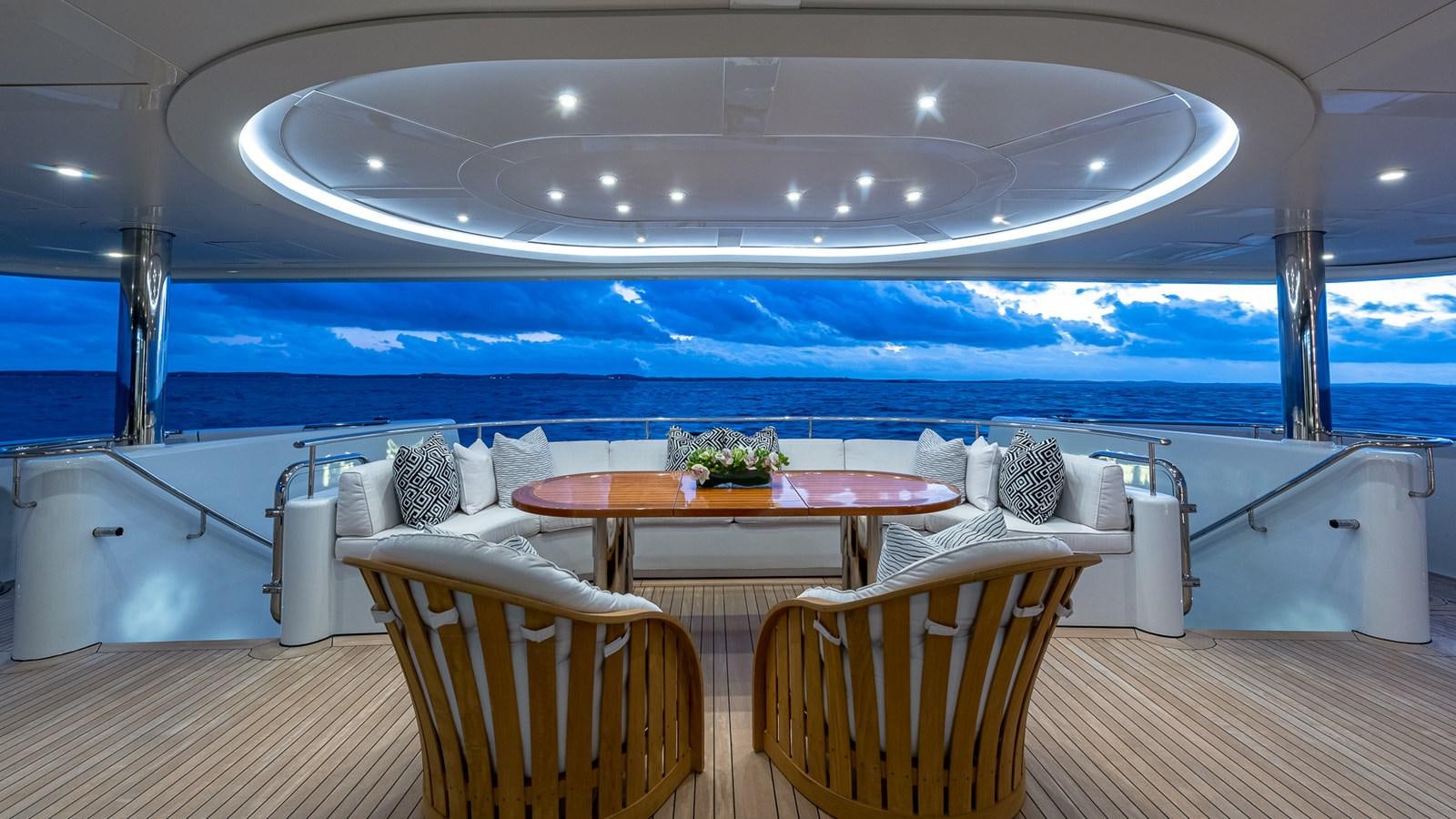 a room with a table and chairs aboard MARGUERITE Yacht for Charter