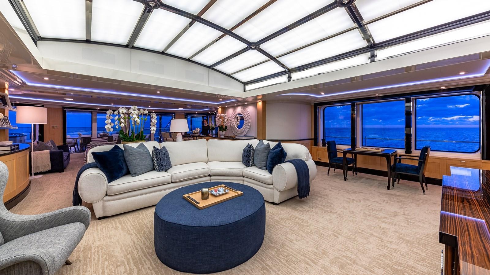 a living room with a large window aboard MARGUERITE Yacht for Charter