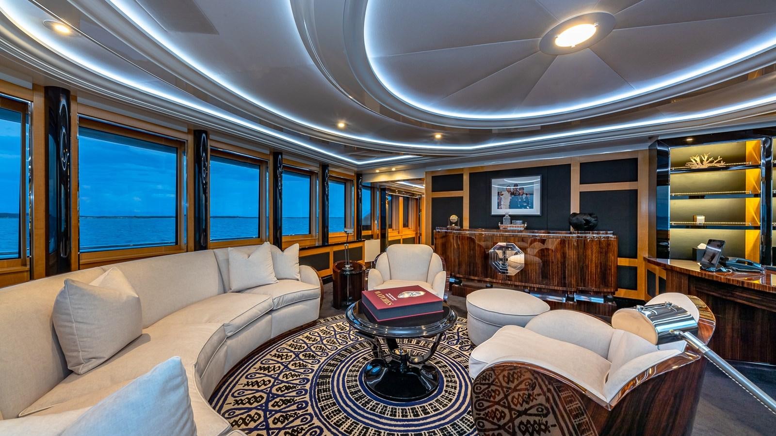 a living room with a large window aboard MARGUERITE Yacht for Charter
